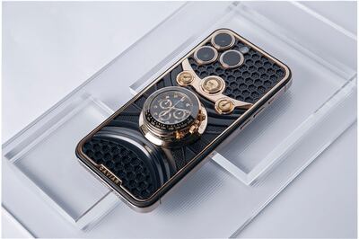 An iPhone encrusted with a Rolex watch. Photo: Caviar Royal Gift