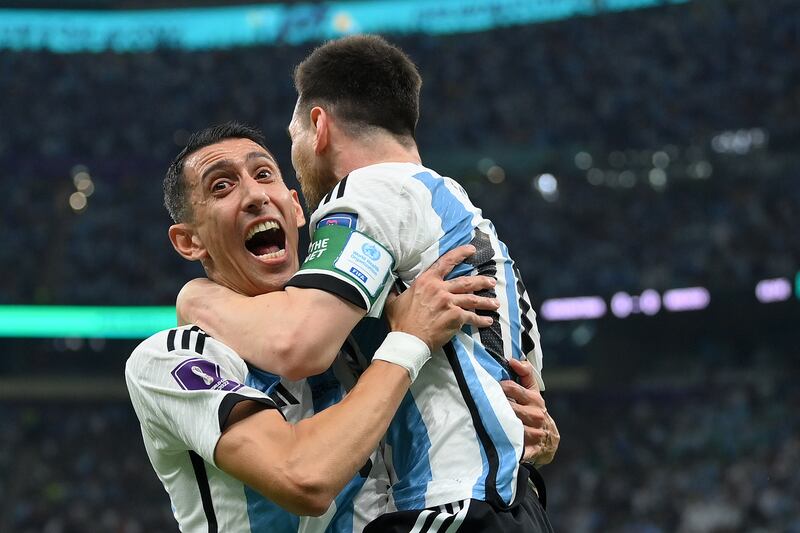 Lionel Messi celebrates with Angel Di Maria. Getty