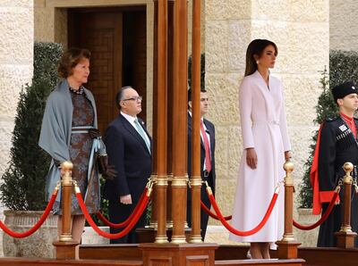 epa08264426 Queen Sonia of Norway (L) and Queen Rania of Jordan (R) look on as King Harald V of Norway and King Abdullah II of Jordan (both unseen) review the Guard of Honor, during the welcome ceremony at al-Husseiniya Palace in Amman, Jordan, 02 March 2020. The King and Queen of Norway arrived in Jordan on 01 March for a four-day official visit. In their first state visit to the Kingdom of Jordan, they are accompanied by a number of officials and an economic delegation.  EPA/AMEL PAIN