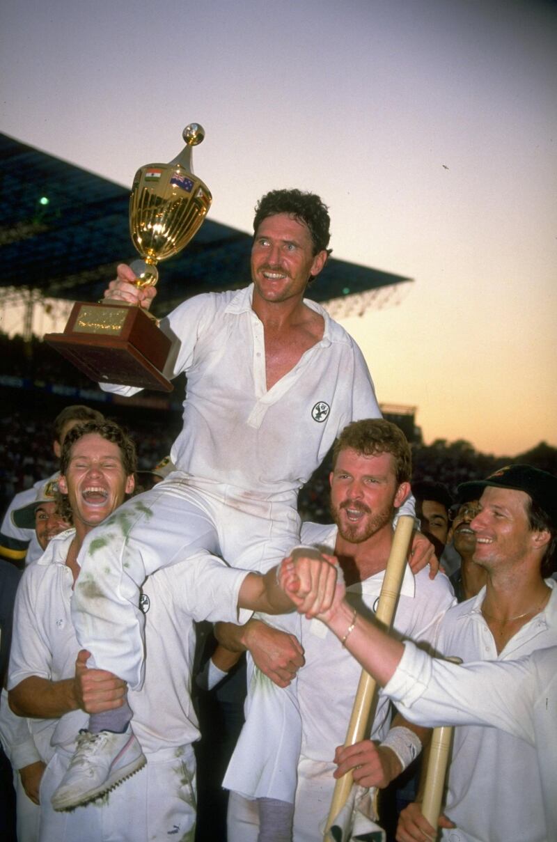 Nov 1987:  Allan Border of Australia is supported by his team mates as he holds the trophy aloft after the World Cup final against England at Eden Gardens in Calcutta, India. Australia won the match by seven runs. \ Mandatory Credit: Chris  Cole/Allsport