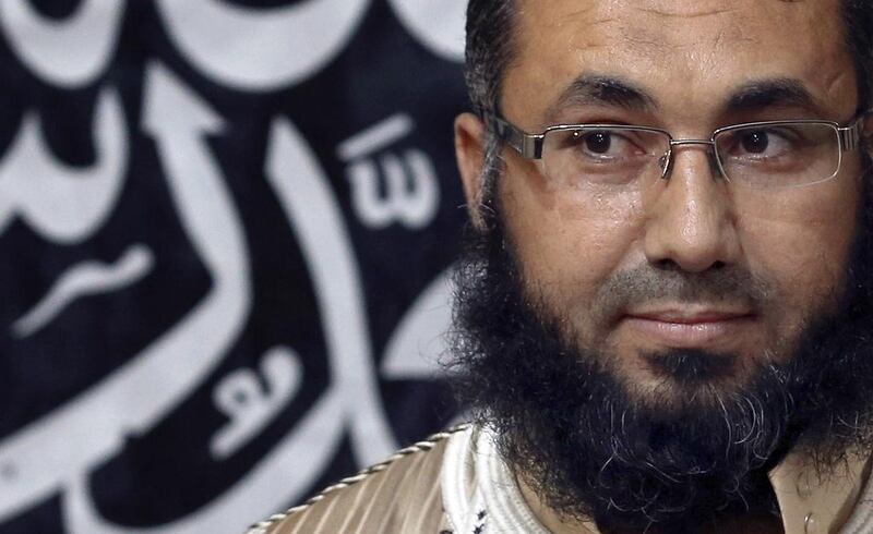 Mohamed Zahawi, head of the Benghazi brigade of Ansar al-Sharia, speaks in Benghazi on Tuesday. Mr Zahawi warned the United States on Tuesday against interfering in the country's crisis or face worse than their conflicts in Somalia Iraq, or Afghanistan. Esam Omran Al-Fetori / Reuters