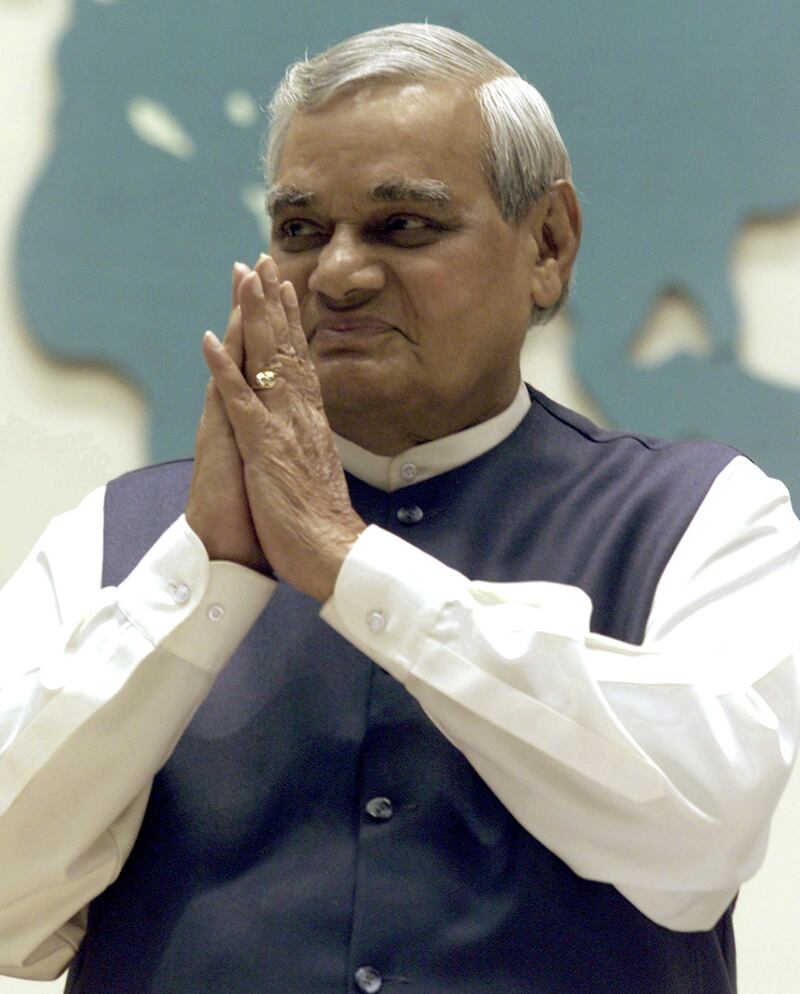 FILE PHOTO: Indian Prime Minister Atal Bihari Vajpayee folds his hands in a traditional Indian style of greeting upon the start of the inauguration of the 73rd Annual Session of the FICCI (Federation of Indian Chambers of Commerce and Industry) gathering in New Delhi, India December 16, 2000.  REUTERS/Kamal Kishore/File Photo