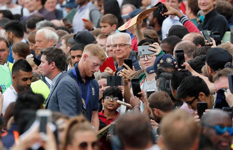 England's Ben Stokes signs autographs at the Oval in London one day after they won the Cricket World Cup in a final match against New Zealand. AP Photo