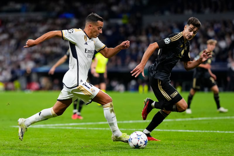 Real Madrid's Lucas Vazquez, left, challenges for the ball with Union's Diogo Leite. AP