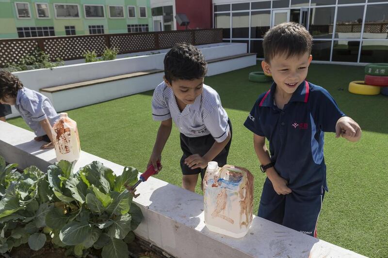 Pupils tend to the garden at Dubai British School Jumeirah Park. The project is part of a campaign to encourage healthy eating. Antonie Robertson / The National