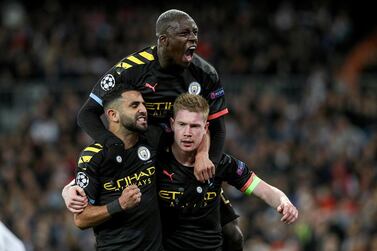 Manchester City midfielder Kevin De Bruyne celebrates with teammates after putting his side ahead at the  Bernabeu stadium in Madrid. EPA