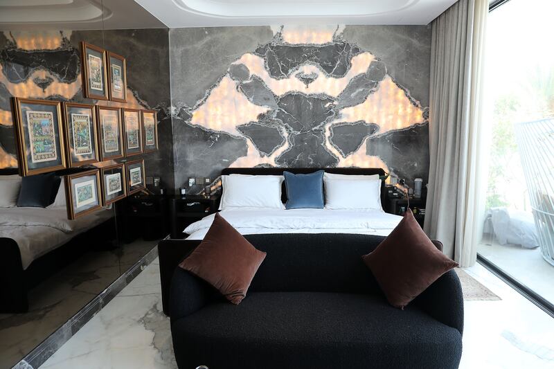 Ali's bedroom features a custom-made backlit marble headboard