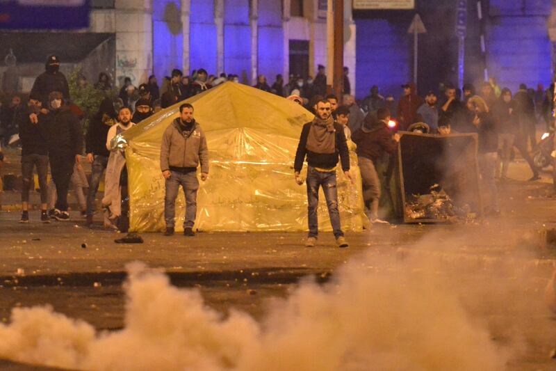 Lebanese anti-government protesters clash with security forces following a demonstration against dire economic conditions, in the northern city of Tripoli. AFP