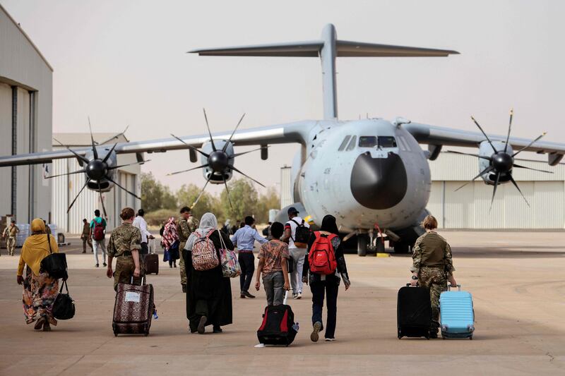 Britions board a Royal Air Force plane in Sudan, for evacuation to Cyprus. AFP