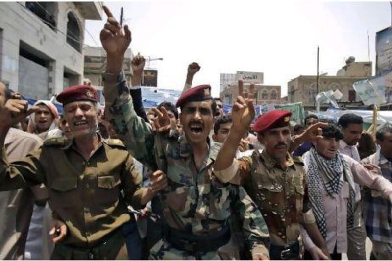 Defected army officers shout slogans during a demonstration by anti-government protesters demanding the resignation of Yemeni President Ali Abdullah Saleh, in Sanaa, Yemen.