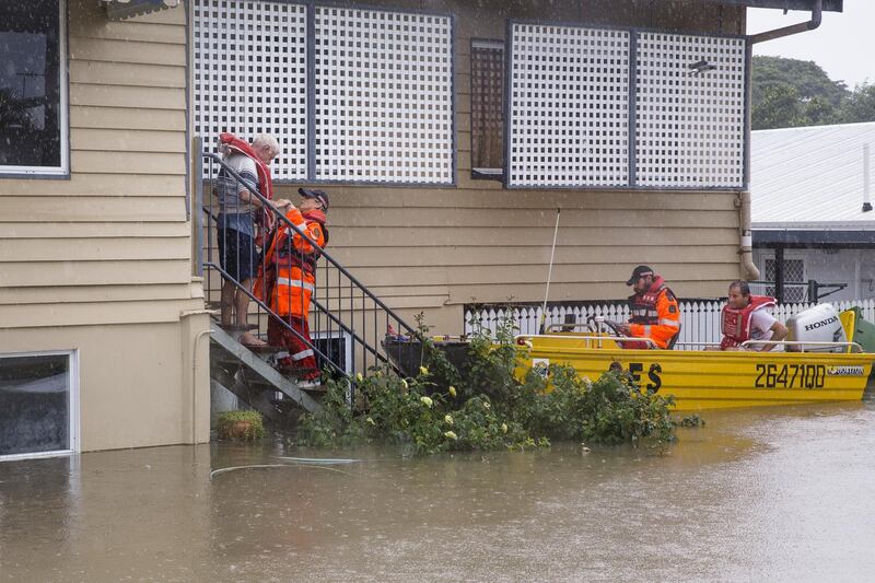 Volunteers are seen rescuing residents in Rosslea.  EPA