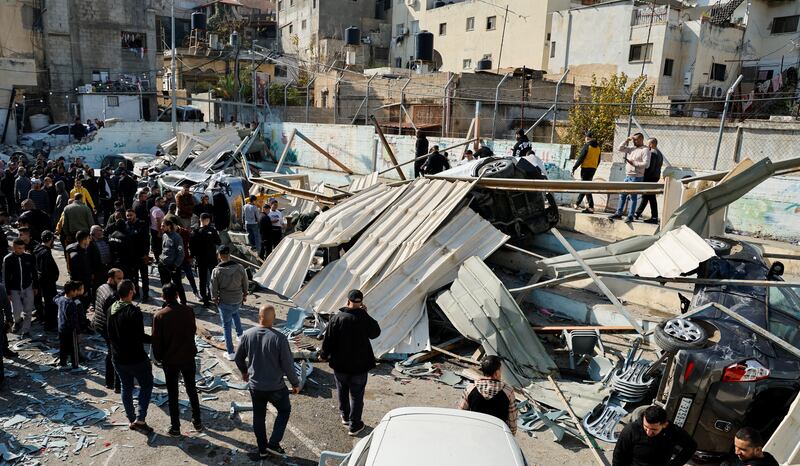 Palestinians inspect the damage following the Israeli raid in Jenin. Reuters