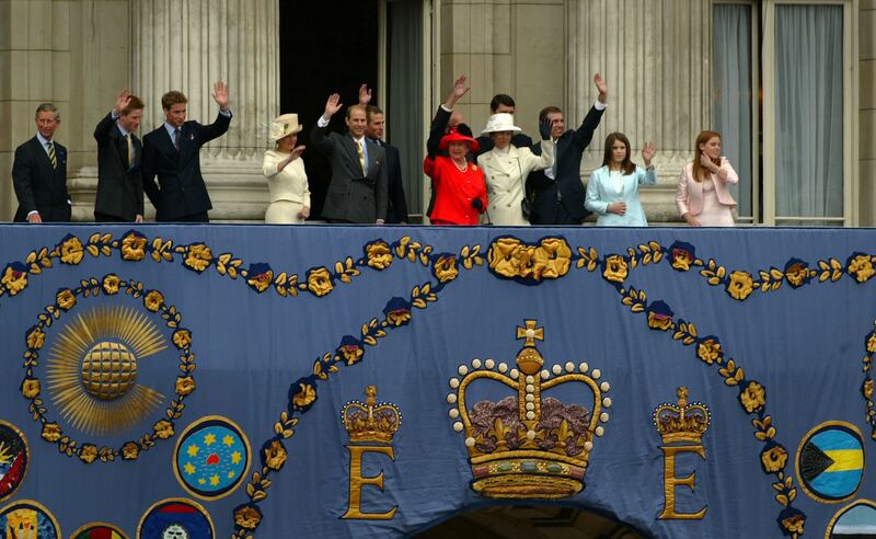 Queen Elizabeth and her family wave to the crowd from the balcony of Buckingham Palace during celebrations of her golden jubilee in June 2002.