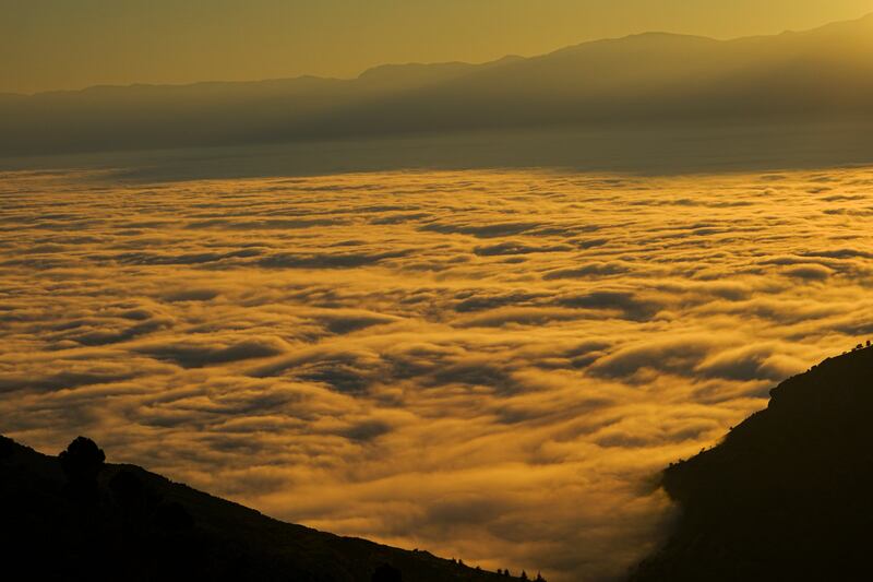 Golden hues of the fog at sunset in Ain Larouz
