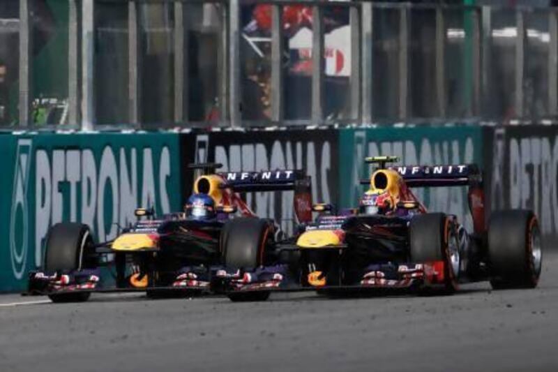 Sebastian Vettel, left, showed his ruthlessness when he passed Red Bull Racing teammate Mark Webber for the win in Malaysia.