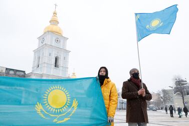 Demonstrators hold Kazakh national flags during a protest against Russian President Vladimir Putin's policies, in Kyiv, Ukraine January 9, 2022.   REUTERS / Valentyn Ogirenko