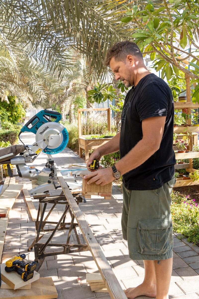 Mr Dunn collects wood from construction sites and makes furniture and wooden plant pots.