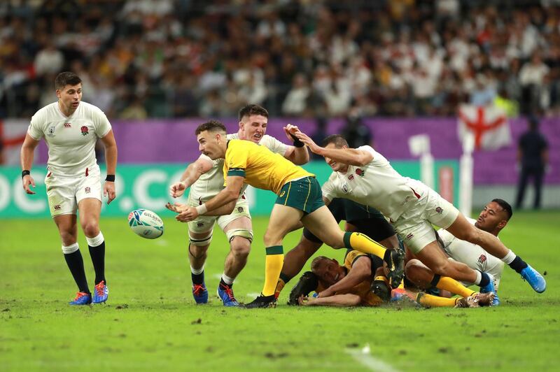 Nic White of Australia offloads the ball during the Rugby World Cup 2019 Quarter Final match between England and Australia at Oita Stadium in Oita, Japan. Getty Images