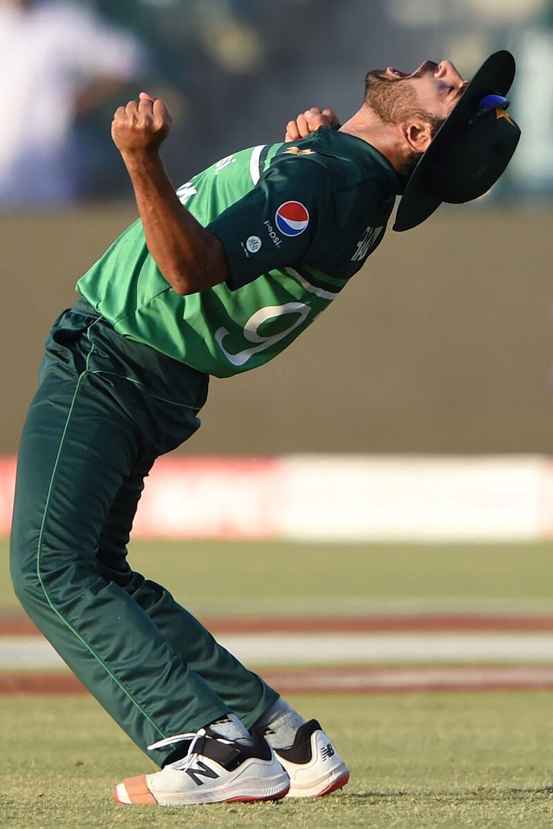 Pakistan's Haris Rauf celebrates after taking the catch to dismiss Australia's Ben McDermott. AFP