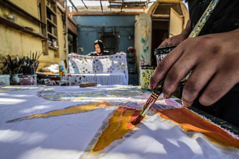 Patterns are applied to fabric at the workshop of Egyptian batik designer Samar Hassanein.