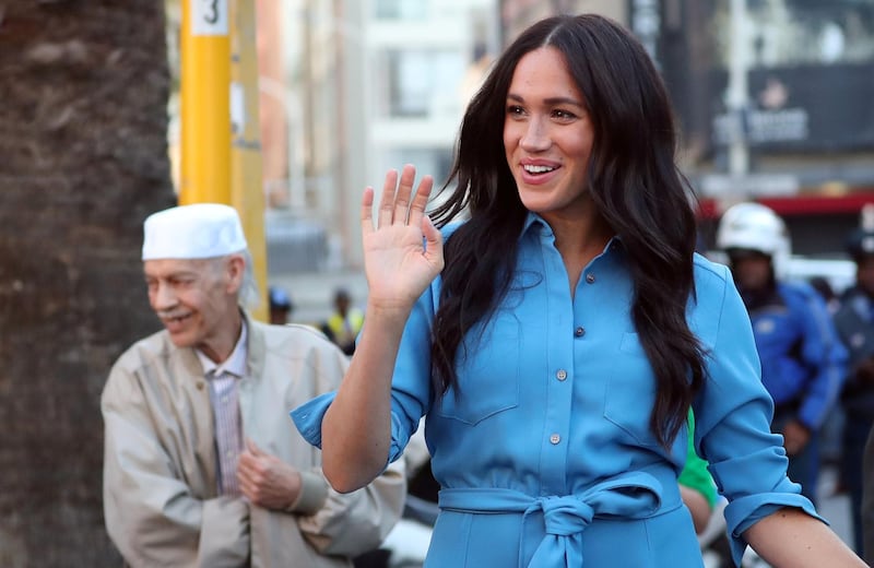 Britain's Meghan, Duchess of Sussex, waves at District Six, on the first day of the African tour in Cape Town, South Africa September 23, 2019. Reuters