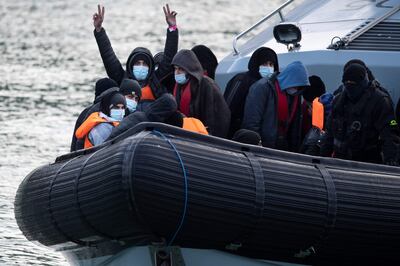 Migrants on board a UK Border Force vessel after being picked up at sea. AFP
