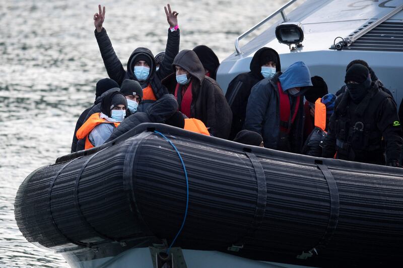 Migrants on board a UK border vessel after being picked up in the English Channel. AFP