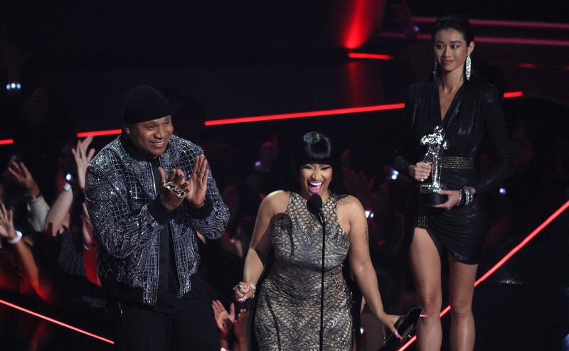 L L Cool J and Nicki Minaj take to the stage to present an award. Reuters