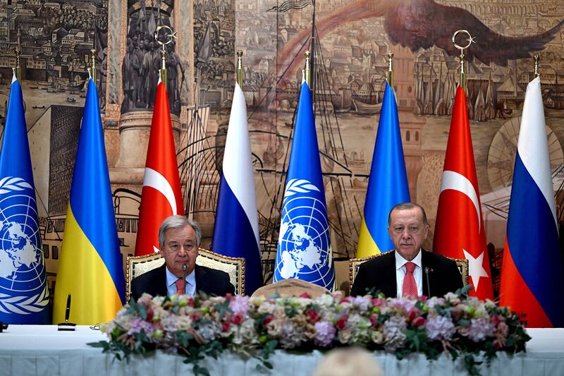 Mr Guterres and Mr Erdogan sit at the start of the signature ceremony for an agreement on the safe transportation of grain and foodstuffs from Ukrainian ports. AFP