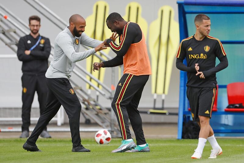 Henry, left, jokes with Romelu Lukaku as Eden Hazard, right, looks on. AP Photo