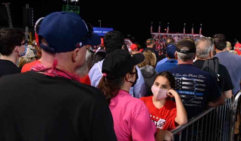 Supporters listen as President Donald Trump speaks at a campaign rally at Atlantic Aviation in Moon Township, Pennsylvania, USA. AFP