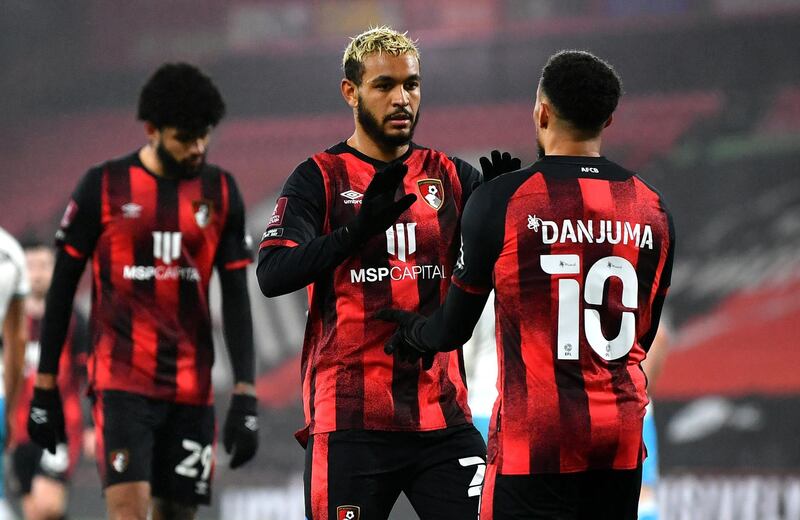 BOURNEMOUTH, ENGLAND - JANUARY 26: Joshua King of AFC Bournemouth celebrates with Arnaut Danjuma after scoring their team's second goal during The Emirates FA Cup Fourth Round match between AFC Bournemouth and Crawley Town at Vitality Stadium on January 26, 2021 in Bournemouth, England. Sporting stadiums around the UK remain under strict restrictions due to the Coronavirus Pandemic as Government social distancing laws prohibit fans inside venues resulting in games being played behind closed doors. (Photo by Dan Mullan/Getty Images)