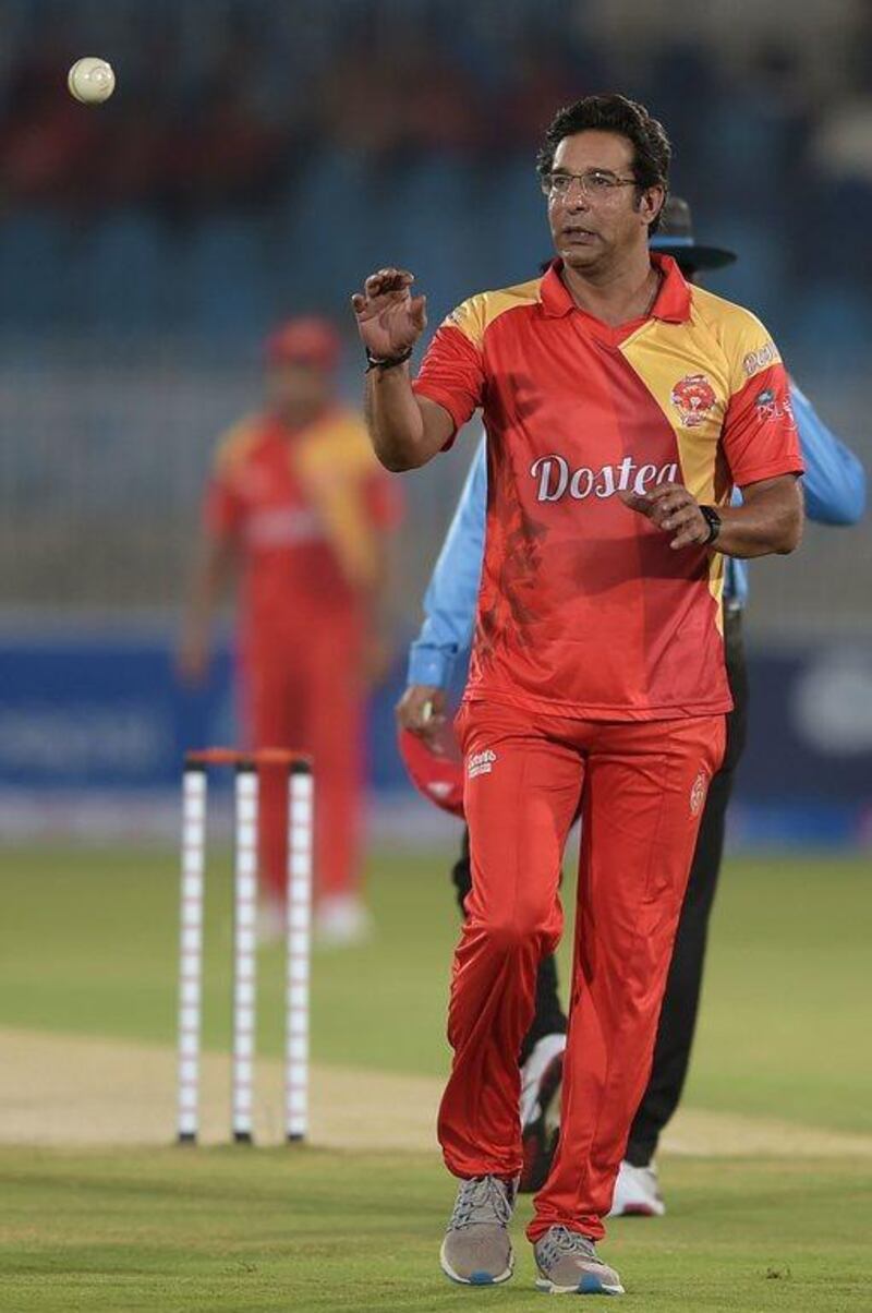 Pakistani director and bowling coach of Islamabad United Wasim Akram prepares to bowl. Aamir Qureshi / AFP