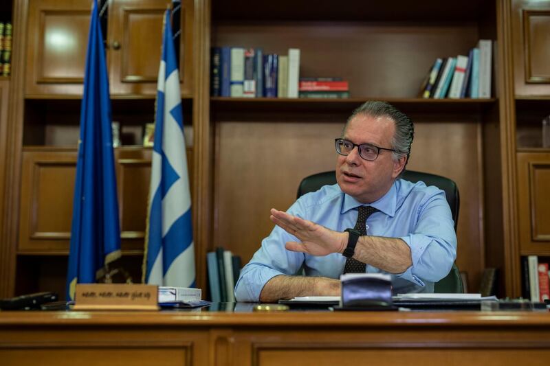 Alternate Minister for immigration policy in the ministry of Citizen's Protection of Greece, George Koumoutsakos speaks to the Associated Press during an interview , in Athens, on Friday, Sept. 27, 2019. Authorities in Greece say seven people have died Friday after a boat carrying migrants sank in the eastern Aegean Sea. (AP Photo/Petros Giannakouris)
