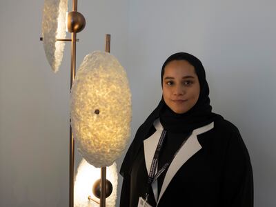 'Tibrah' by Reema Al Mheiri, is a floor lamp with three shades made from fish scales. Antonie Robertson / The National
