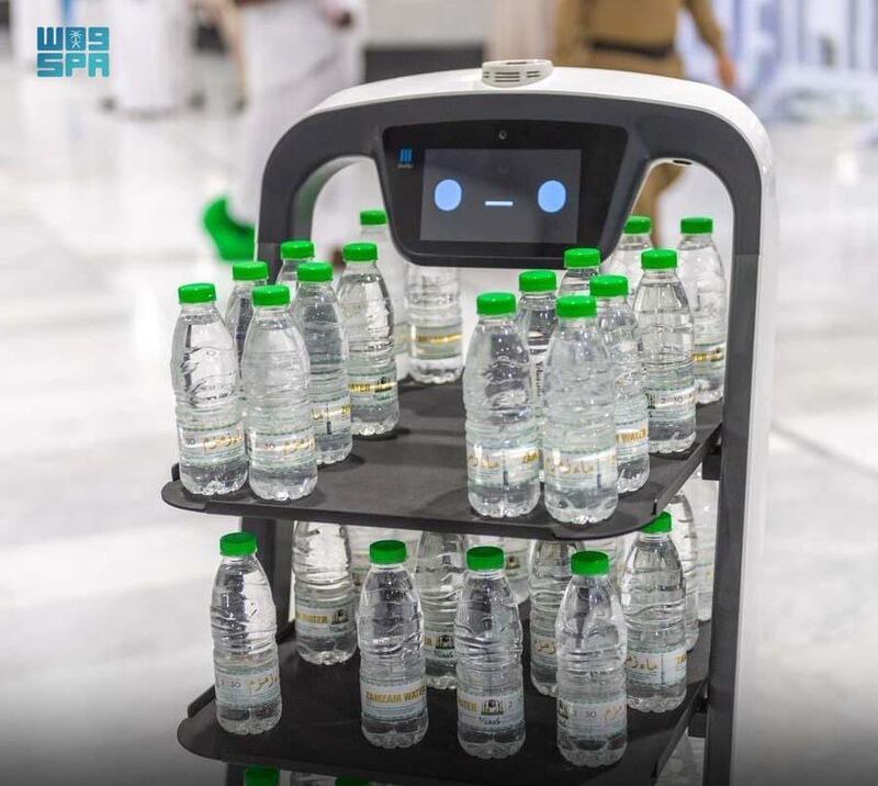 Robots serving Zamzam water bottles at the Grand Mosque in Makkah. SPA