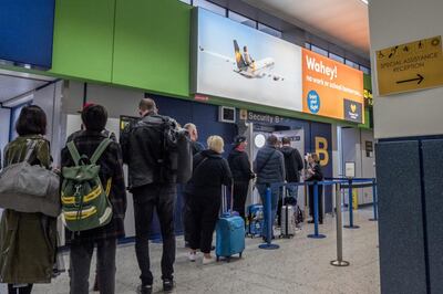 MANCHESTER, ENGLAND - SEPTEMBER 22: Passengers wait to go through to the Thomas Cook check-in desks at Manchester Airport on September 22, 2019 in Manchester, England.Thomas Cook is holding emergency talks with potential investors to try and secure around £200m to avert its collapse. If the company does go under, approximately 150,000 British holidaymakers could be stranded abroad with the potential loss of many thousands jobs in the UK. (Photo by Anthony Devlin/Getty Images)