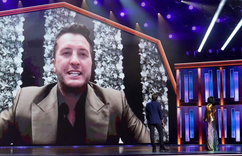 Luke Bryan appears on screen accepting the award for Entertainer of the Year at the 56th annual Academy of Country Music Awards  at the Grand Ole Opry in Nashville. AP Photo