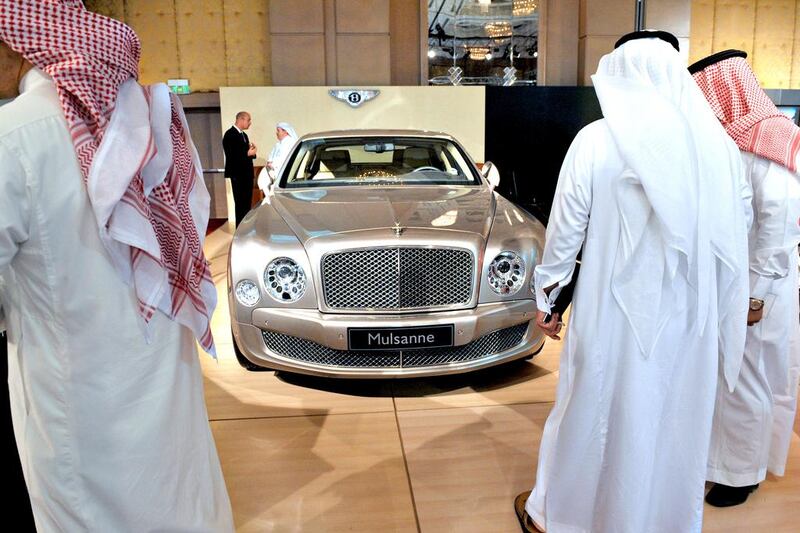 3. Saudi Arabia: Saudi men look at a Bently during a luxury auto show in Riyadh. Fayez Nureldine / AFP