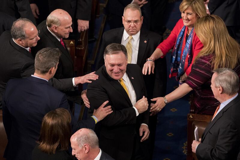 MikePompeo, director of the Central Intelligence Agency (CIA), center, arrives ahead of a State of the Union address to a joint session of Congress at the U.S. Capitol in Washington, D.C., U.S., on Tuesday, Jan. 30, 2018. Trump sought to connect his presidency to the nation's prosperity in his first State of the Union address, arguing that the U.S. has arrived at a "new American moment" of wealth and opportunity. Photographer: Aaron P. Bernstein/Bloomberg