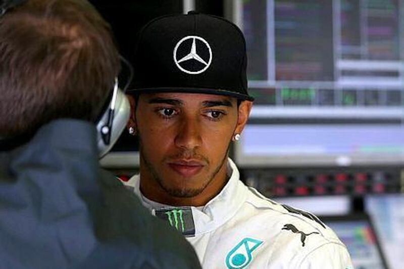 Lewis Hamilton of Great Britain and Mercedes GP looks on in the garage during qualifying ahead of the Belgian Grand Prix at Circuit de Spa-Francorchamps on August 23, 2014 in Spa, Belgium. (Photo by Mark Thompson/Getty Images)