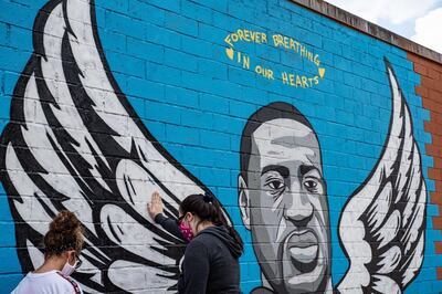 HOUSTON, TX - JUNE 02: A mural of George Floyd is shown painted on the side of Scott Food Mart in the Third Ward before a march in his honor on June 2, 2020 in Houston, Texas. Family members of Floyd were scheduled to participate in a march from Discovery Green to City Hall with support from the local chapter of Black Lives Matter. Floyd, a former resident of the Third Ward, died May 25 while in police custody in Minneapolis, Minnesota.   Sergio Flores/Getty Images/AFP
== FOR NEWSPAPERS, INTERNET, TELCOS & TELEVISION USE ONLY ==
