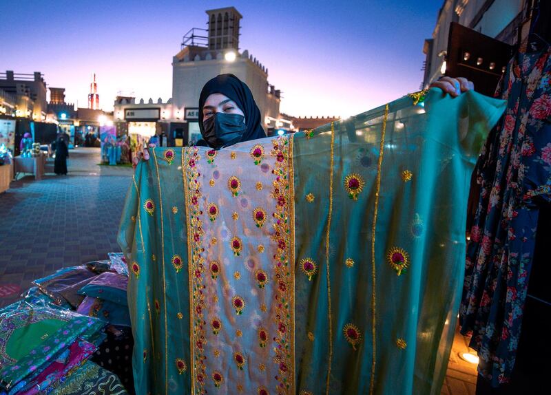 Abu Dhabi, United Arab Emirates, January 10, 2021.  Mariam Al Shehi displays a hand stiched cloth at the Arabic market at Sheikh Zayed Festival.
Victor Besa/The National
Section:  NA
Reporter:  Saeed Saeed