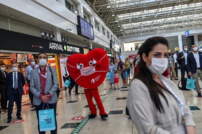 People keep social distance at Antalya International airport in southern Turkey. AFP