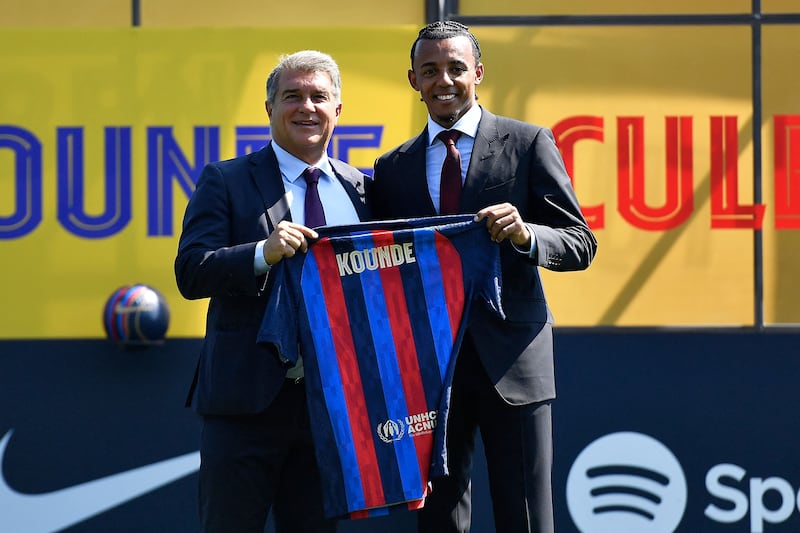 Barcelona's new French defender Jules Kounde with president Joan Laporta. AFP