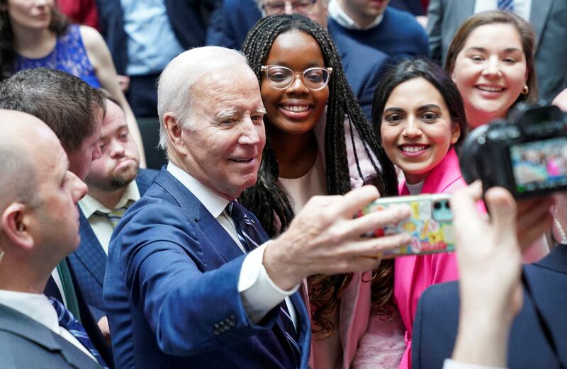 Joe Biden took a selfie with students after giving a speech at Ulster University in Belfast. Reuters