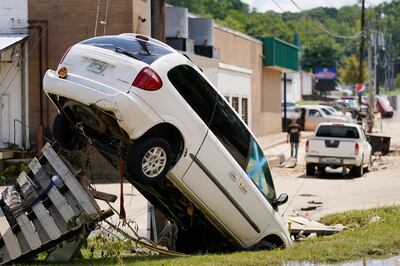 A car leans against a utility pole Sunday, Aug.  22, 2021, in Waverly, Tenn. (AP Photo / Mark Humphrey)