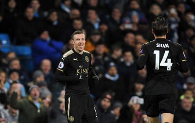 Leicester's Jamie Vardy, left, celebrates with Adrien Silva after scoring his side's opening goal during the English Premier League soccer match between Manchester City and Leicester City at the Etihad Stadium in Manchester, England, Saturday, Feb. 10, 2018. (AP Photo/Rui Vieira)