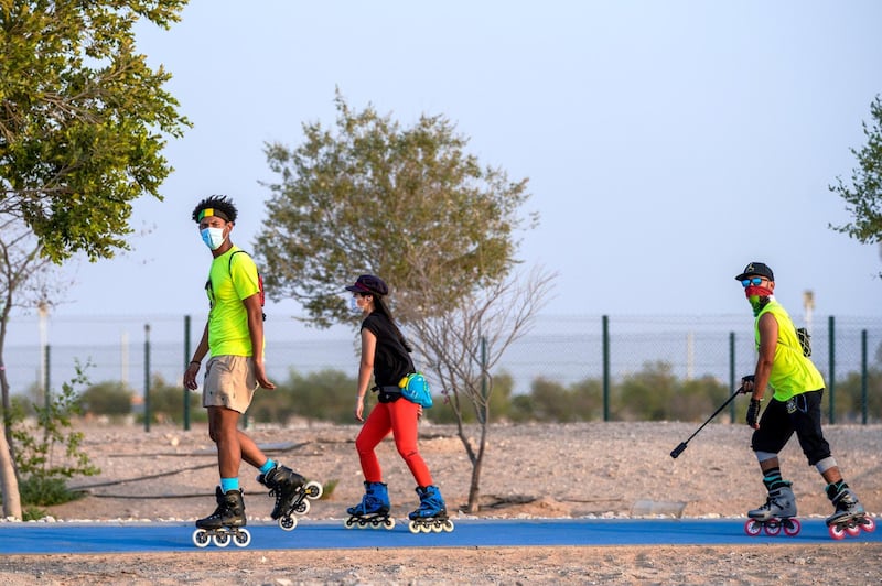 Abu Dhabi, United Arab Emirates, May 26, 2020.  
  Khalifa City residents wearing face masks trying to keep fit during the Eid break at Masdar Park exercise pathway during the Covid-19 pandemic.
Victor Besa  / The National
Section:  Standalone / Stock