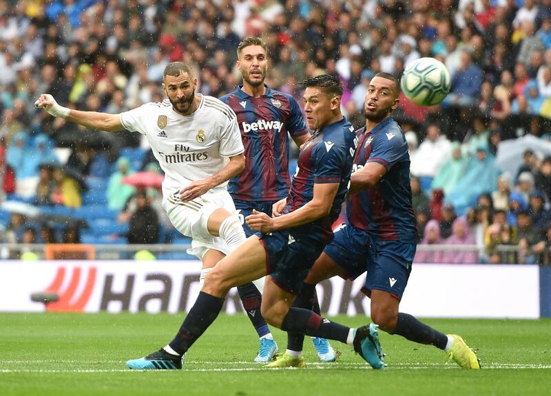 Real Madrid striker Karim Benzema shoots on goal during the La Liga match against Levante at Santiago Bernabeu. Benzema scored twice in a 3-2 win for Real Madrid. Getty Images